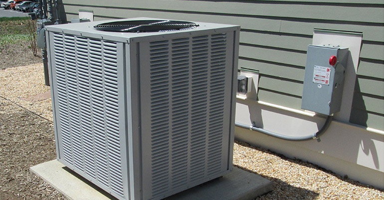 Image of HVAC unit outside family home.